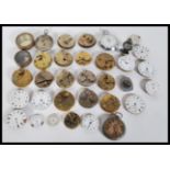 A collection of vintage 20th Century pocket watch parts, movements, faces and spares to include