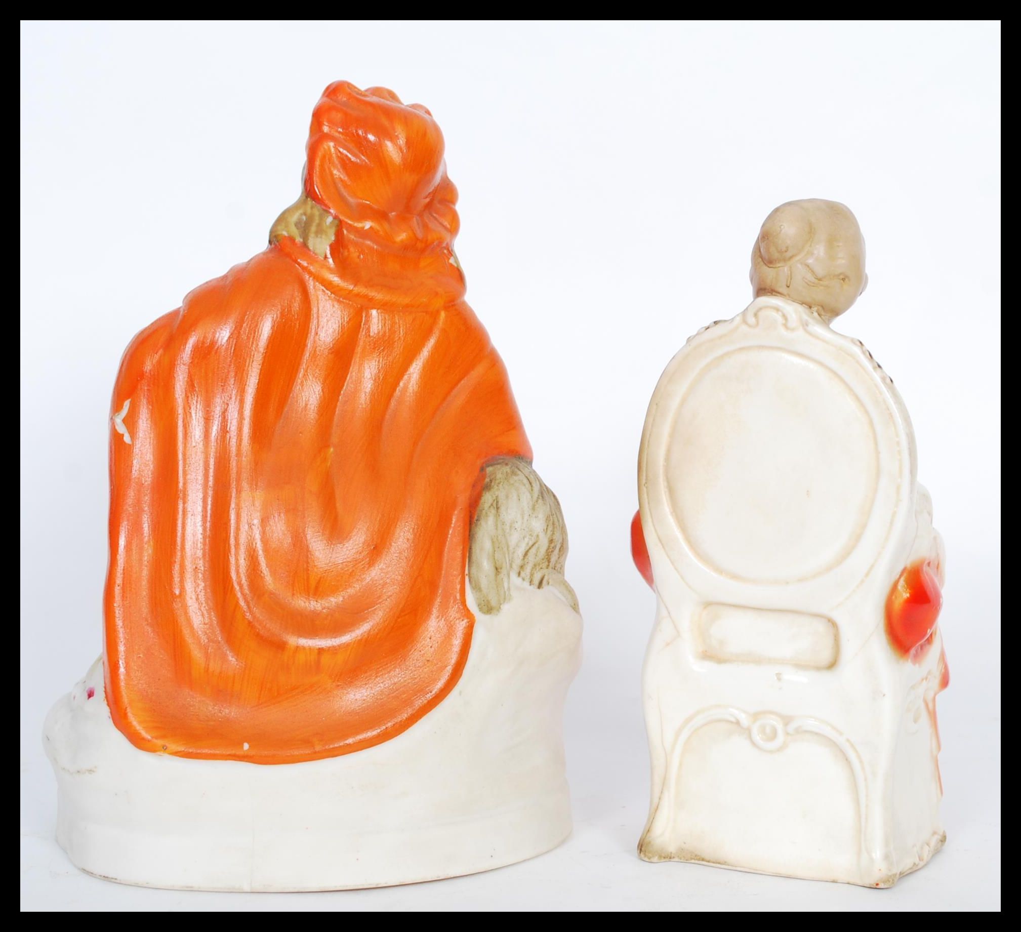 Two 19th Century ceramic figures to include a seated lady with a dog and another seated lady with - Image 3 of 5