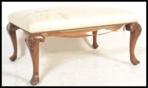 A Georgian style Regency revival large mahogany stool raised on scrolled cabriole legs with acanthus