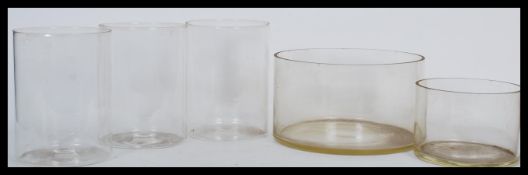A selection of 20th Century laboratory large glass vessels of cylindrical form ,three matching and