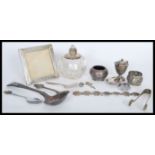 A group of vintage silver and white metal items to include a silver white metal picture frame of