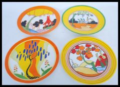 A set of four Clarice Cliff for Wedgwood limited edition collectors cabinet plates by The Bradford