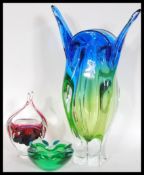 A retro two tone large iridescent studio art glass molar vase together with another two similar