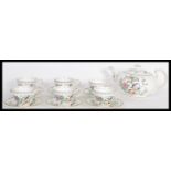 A  bone China tea service by Aynsley in the Pembroke pattern, consisting of tea cups, saucers,