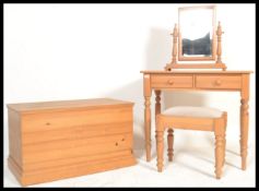 An antique style country pine blanket box, dressing table and matching stool. The blanket box of