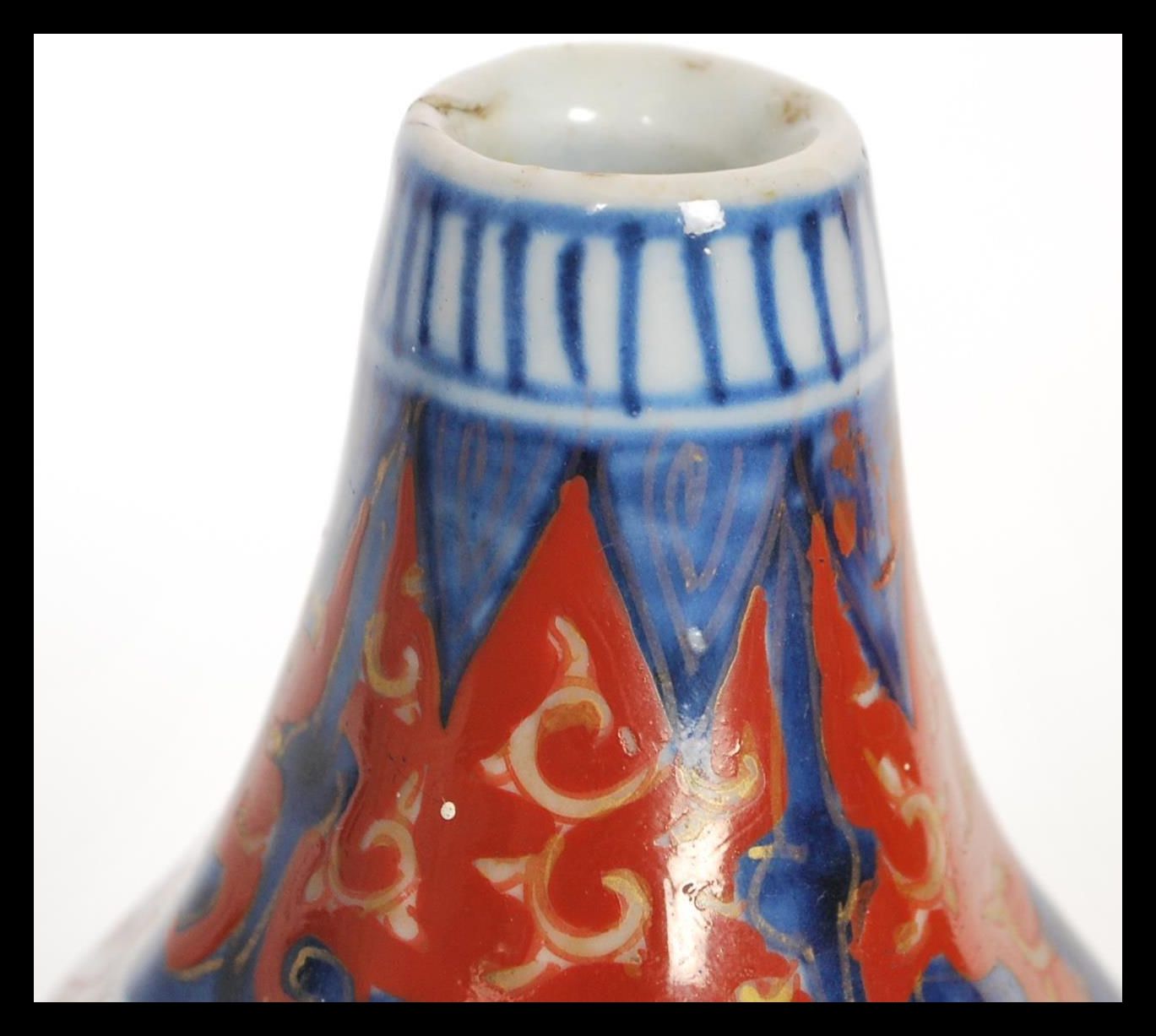 Two small oriental vases to include a lidded baluster vase having painted blue foliate patterning - Image 4 of 5