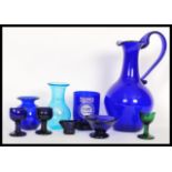 A collection of Bristol blue glass and others to include a large Bristol Blue glass ewer / water jug