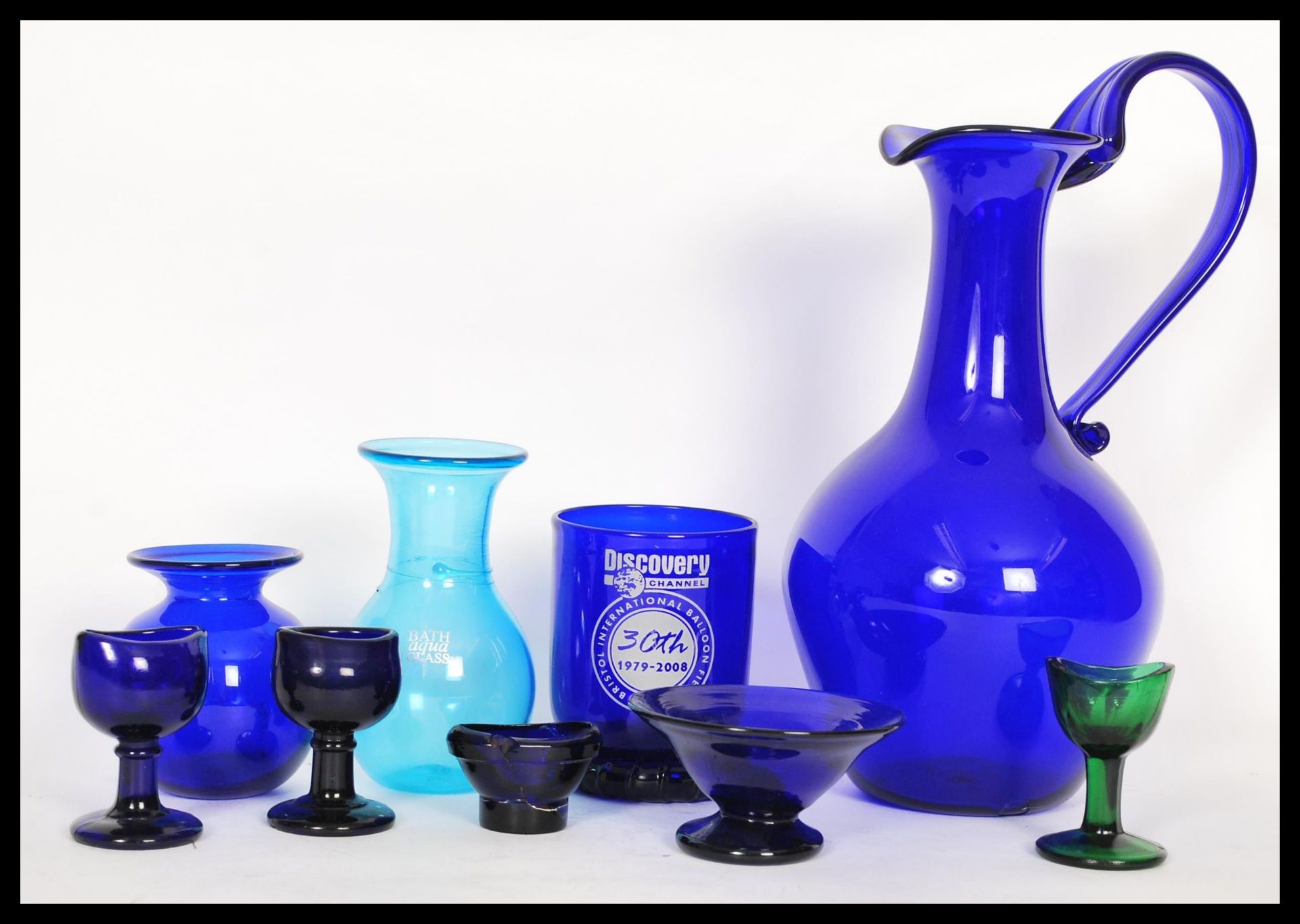 A collection of Bristol blue glass and others to include a large Bristol Blue glass ewer / water jug