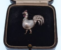 EARLY 20TH CENTURY RUBY DIAMOND AND PEARL COCKEREL BROOCH