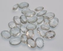 A selection of oval mixed cut Beryl variety Aquamarine loose gemstones. Sizes ranging around 9mm x