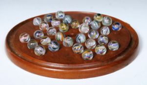 19TH CENTURY VICTORIAN SOLITAIRE BOARD WITH GLASS MARBLES.