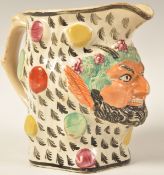 LATE 18TH CENTURY PRATTWARE JUG IN THE FORM OF A SATYR HEAD