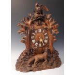 A 19TH CENTURY VICTORIAN WOODEN BLACK FOREST CUCKOO MANTEL CLOCK