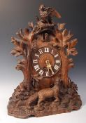 A 19TH CENTURY VICTORIAN WOODEN BLACK FOREST CUCKOO MANTEL CLOCK