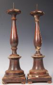 A PAIR OF 17TH CENTURY LARGE WOODEN PRICKET CANDLESTICKS