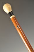 AN EARLY 18TH CENTURY IVORY AND EBONY TOPPED WALKING STICK CANE