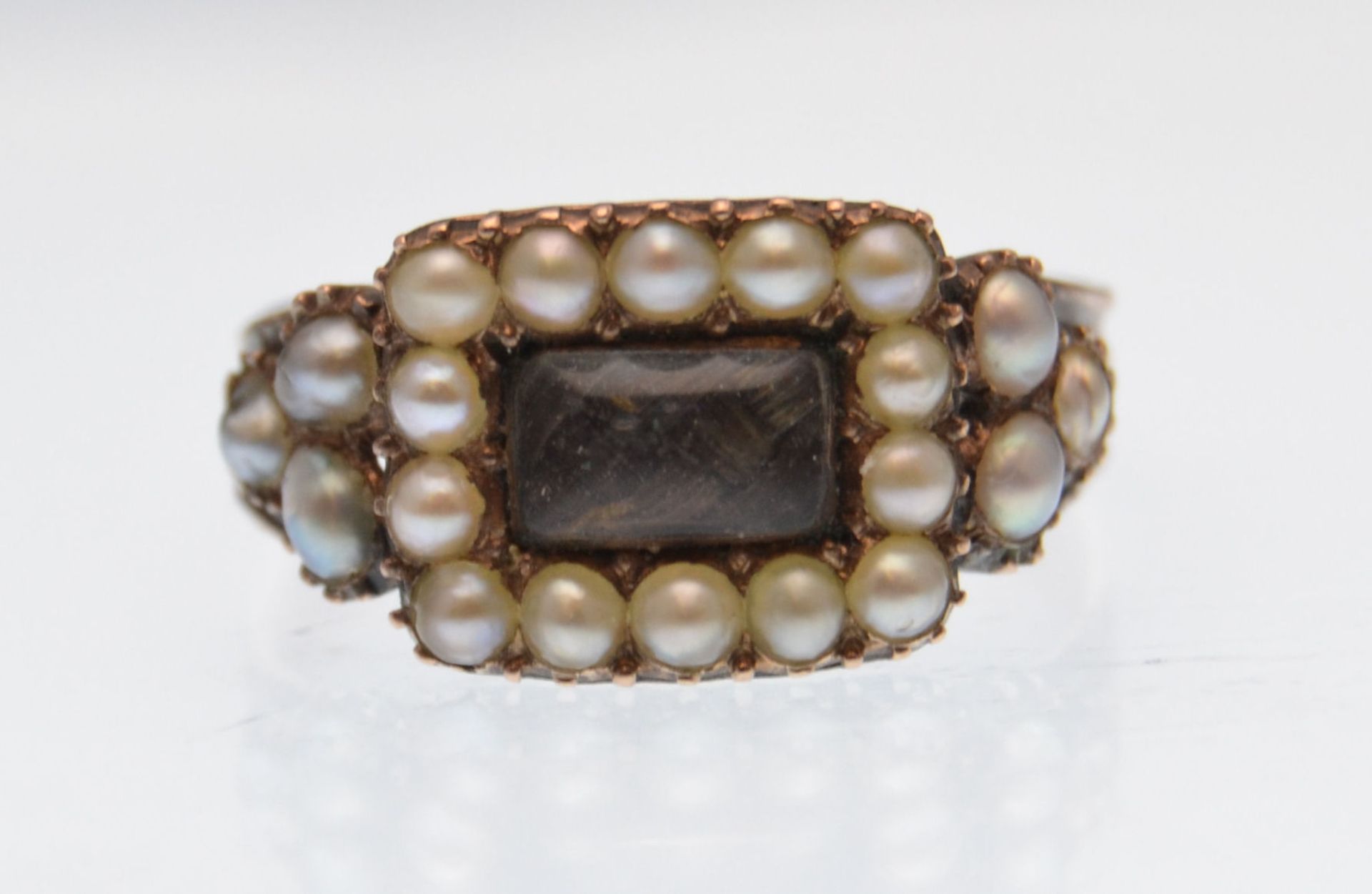 EARLY 19TH CENTURY GOLD AND HALF PEARL MEMORIAL RING