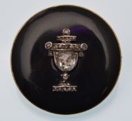 A regency gold onyx and diamond mourning locket . The brooch having a central urn motif set with