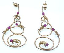 A pair of oversized 18ct gold ruby and diamond statement chandelier figural bug earrings. The