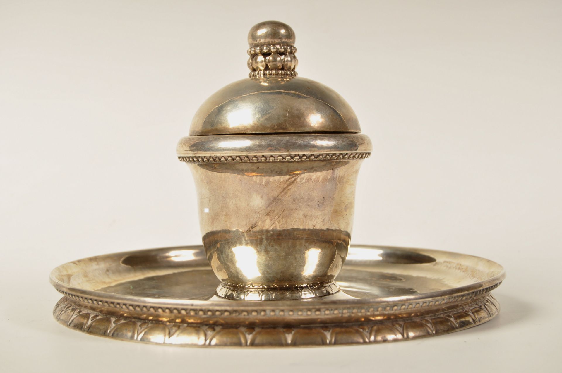 GEORG JENSEN SILVER CAPSTAN INKWELL RAISED ON CIRCULAR BASE