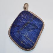 A 925 silver and lapis lazuli necklace pendant. The pendant having a central natural unpolished