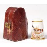 A ROYAL WORCESTER THIMBLE BY W POWELL PAINTED WITH GOLDFINCH