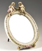 A GERMAN SITZENDORF PORCELAIN CHERUB BARBOLA EASEL MIRROR