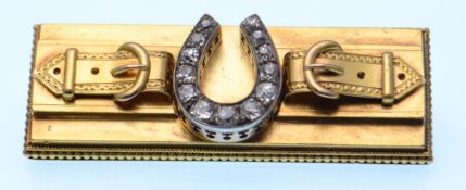 EARLY 20TH CENTURY GOLD AND DIAMOND HORSESHOE BROOCH