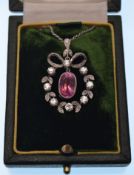 A white gold pink sapphire and diamond Belle Epoque pendant necklace. The pendant having a central