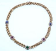 A 14ct gold, emerald, ruby, sapphire and diamond necklace