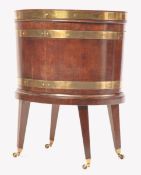 GEORGE III MAHOGANY AND BRASS BOUND OVAL SHAPED WINE COOLER