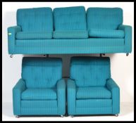 A vintage retro three piece suite comprising sofa
