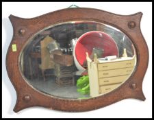 A vintage 1920's Art Deco oval wall mirror having