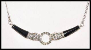 A sterling silver and onyx necklace having a flat