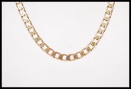 A stamped 375 9ct gold curb chain necklace set wit