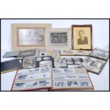 A collection of vintage antique photographs in alb