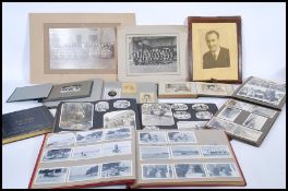 A collection of vintage antique photographs in alb
