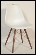 A contemporary dining slide chair in the style of