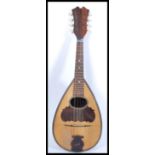 A vintage early 20th Century mandolin musical inst