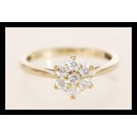 A hallmarked 9ct gold and diamond cluster ring set