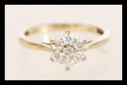 A hallmarked 9ct gold and diamond cluster ring set