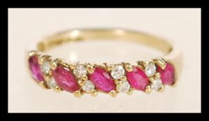 A hallmarked 9ct gold ruby and diamond ring set wi