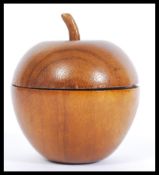 A 20th wooden tea caddy in the form of an apple ha