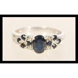 A hallmarked 9ct white gold diamond and sapphire r