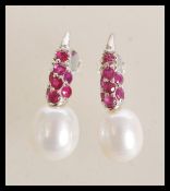 A pair of sterling silver freshwater pearl and rub