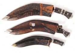 20TH CENTURY MIDDLE EASTERN KUKRI KNIVES WITH SCABBARDS