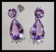 A pair of large sterling silver amethyst drop earr