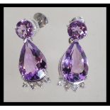 A pair of large sterling silver amethyst drop earr