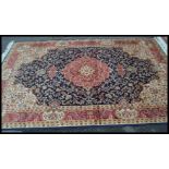 A large Persian floor carpet Keshan rug having a b