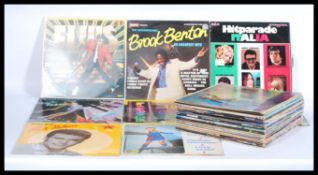 A collection of vinyl long play LP records featuri